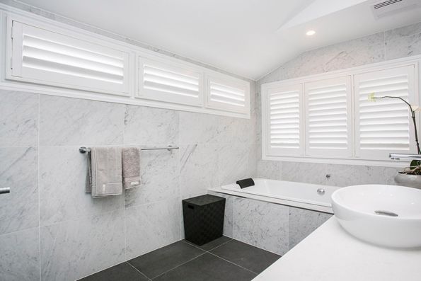 Sylish bathroom with new plantation shutters | Featured Image for the Plantation Shutters Brisbane Page of Shutters, Blinds & Awnings. 